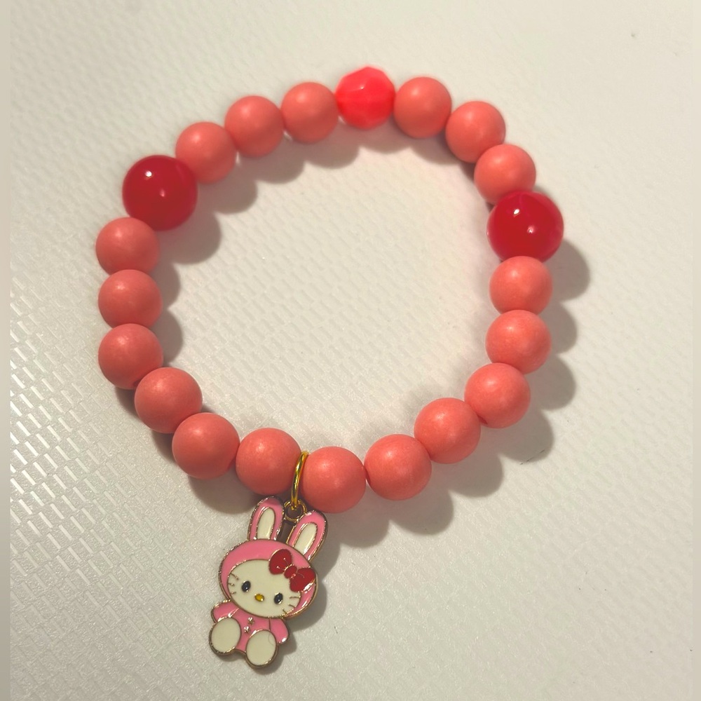 Hello kitty charm bracelet with dark pink beads